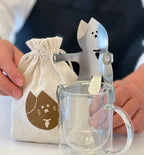 driping cat coffee rack on the top of a glass cup